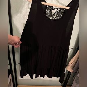 Black tank with cinched waist and gorgeous detailing